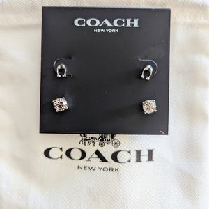 Coach signature earring set. Brand new. Never worn tags included.